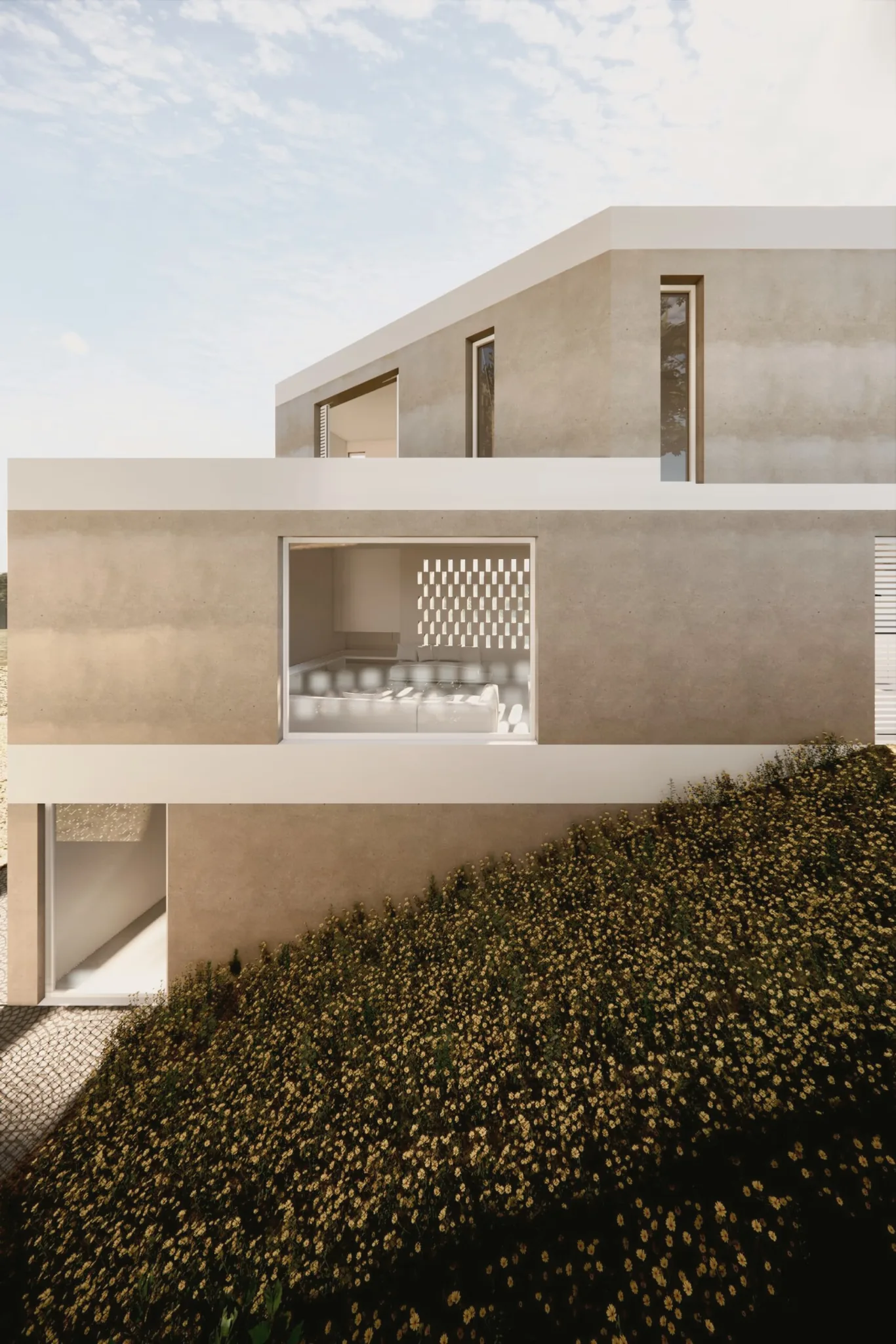 Fachada sur sobre el terreno con pendiente, vivienda Escaletes